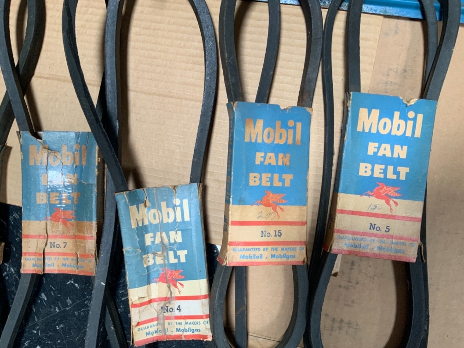 Original Mobil Fan Belt Display Rack with original belts and packaging