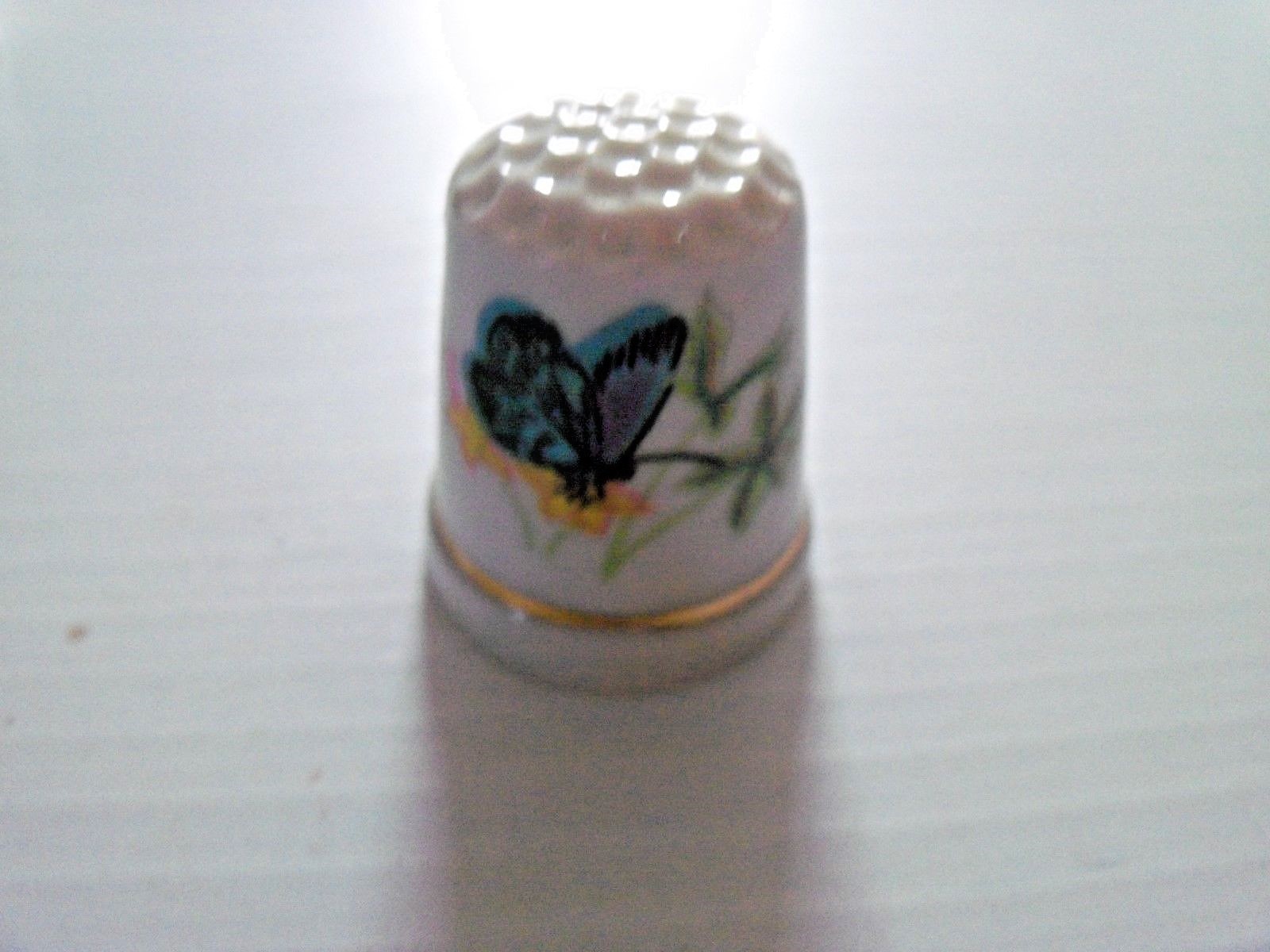 Lot of 7 Porcelain Thimble with Butterfly Pictured On It