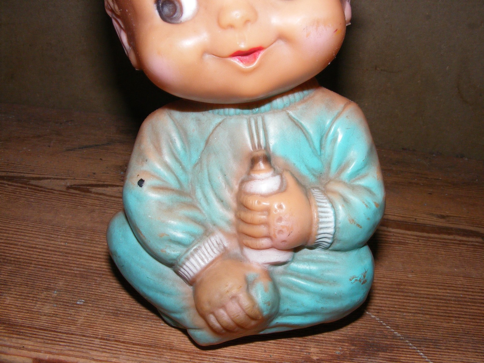 Vintage rubber baby doll happy  holding bottle squeak