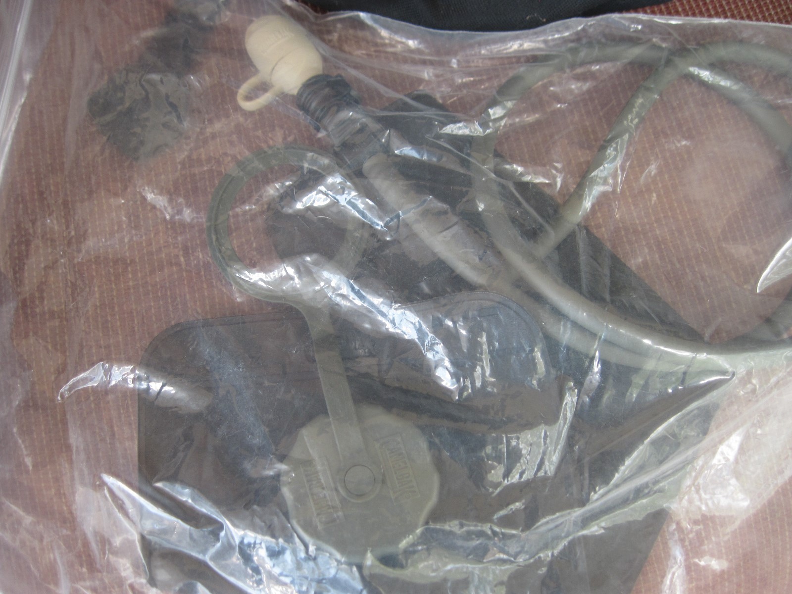 CAMELBAK WITH POCKETS AND NEW BLADDER   BLACK IN  COLOR