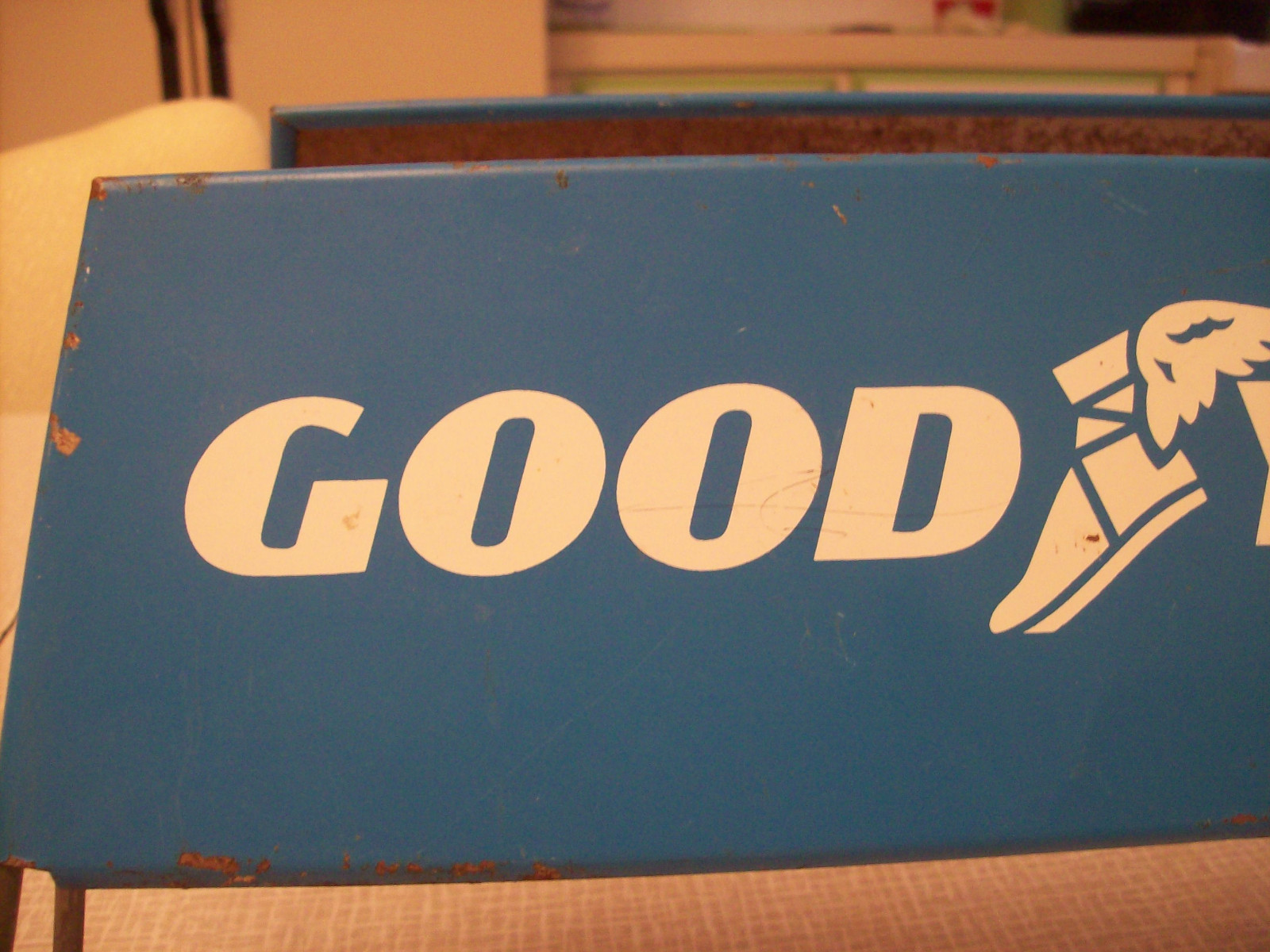 Goodyear tire stand, wing foot, vintage tire shop advertising