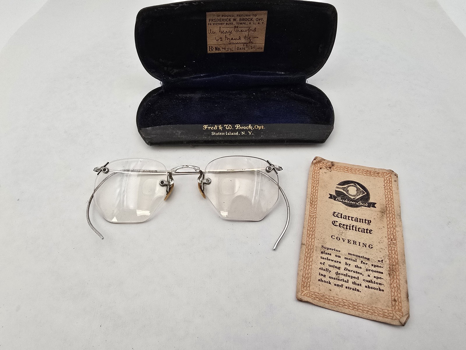 Dr Frederick Brock Optician Paper Rx Staten Island NY Rimless Glasses Case