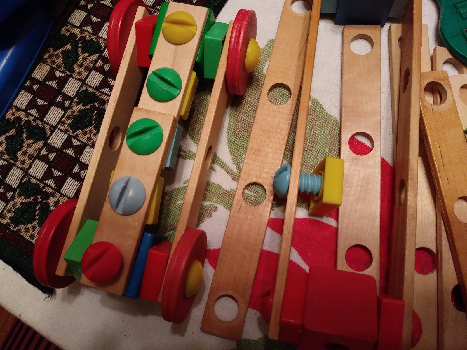 Wooden Erector Set with Plastic Nuts and Bolts, no box or container.