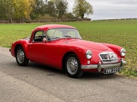 1955 MG A 1500 coupe, bright red with black leather interior.