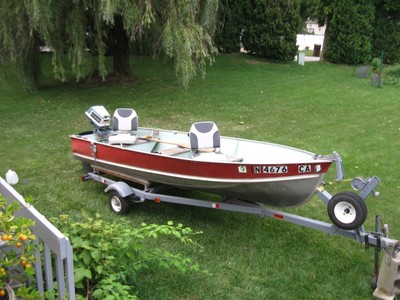 Lund 14' with Evinrude motor and trailer plus many accessories