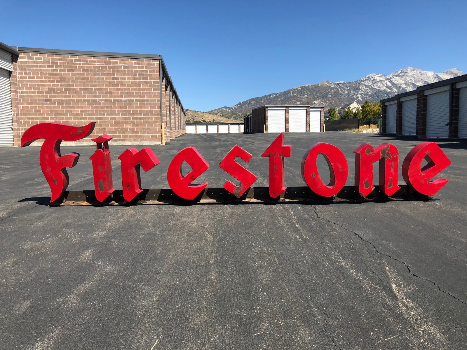 Heavy Duty Vintage Firestone Sign attached to Steal Beam