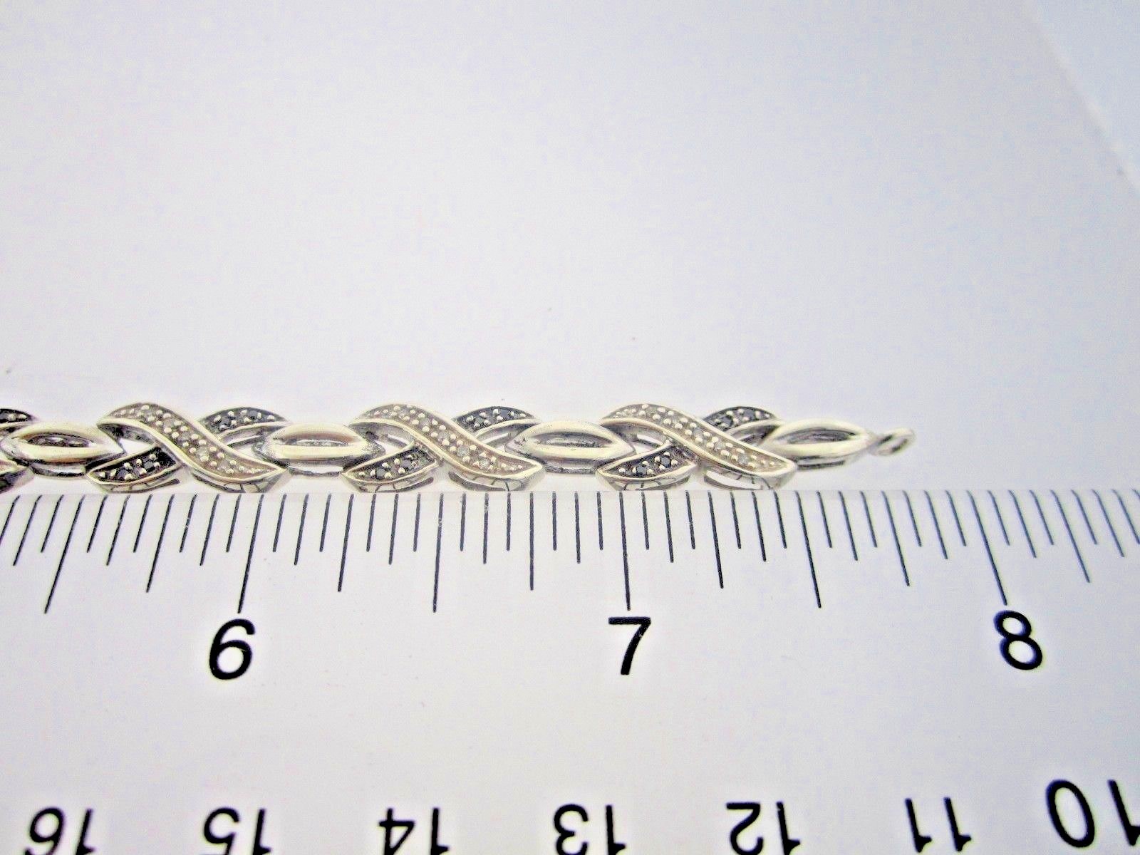 * .925 STERLING SILVER 1/2 CARAT X DESIGN BLACK & WHITE DIAMOND TENNIS BRACELET