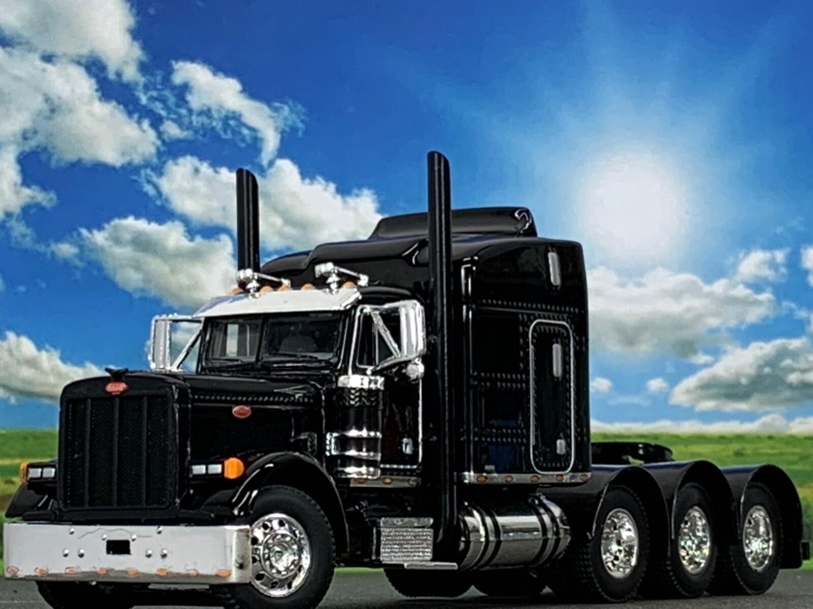 1/64 DCP BLACK PETERBILT 379 TRI AXLE W/ 63