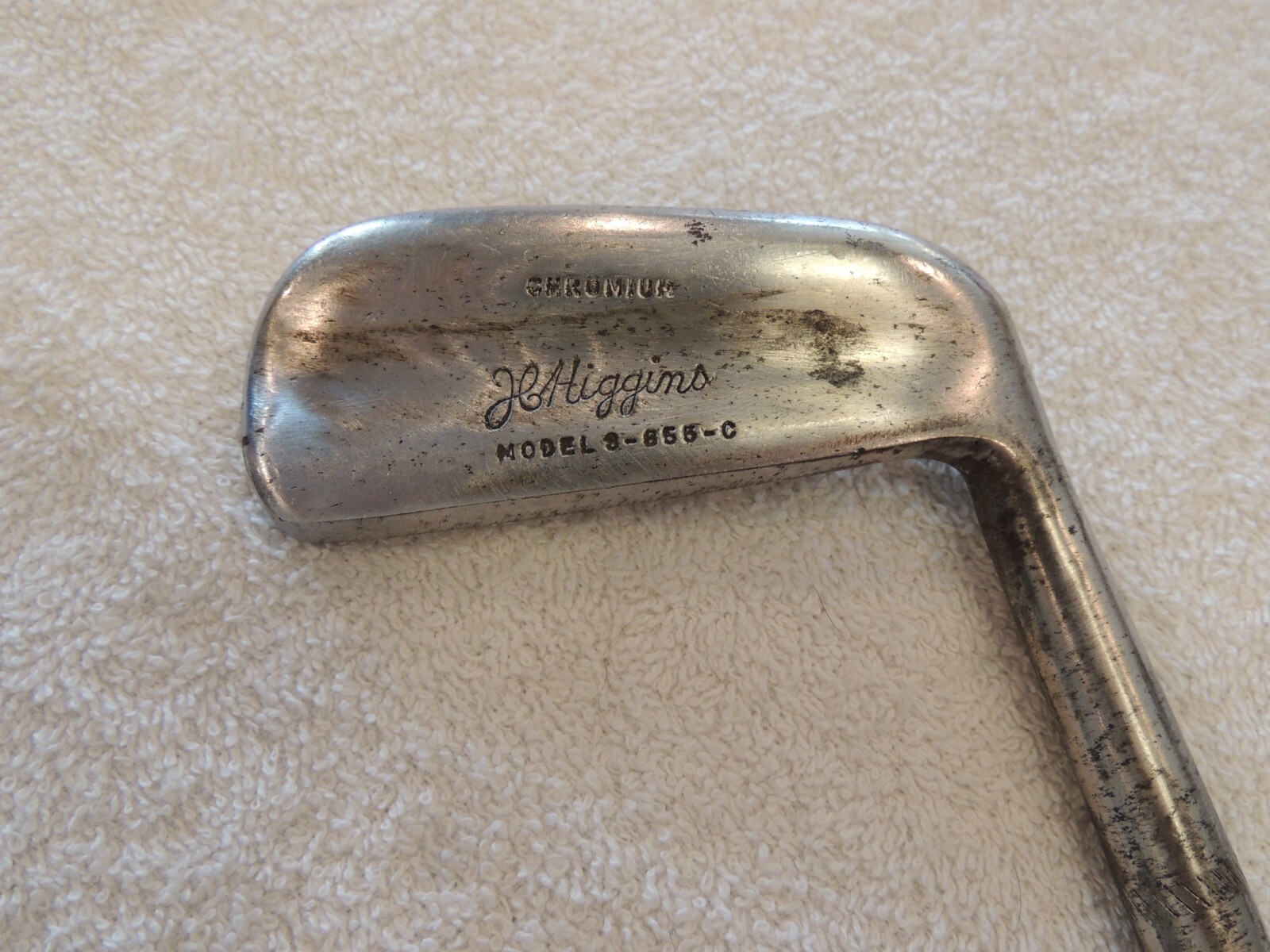 JC Higgins chromium model 3-855-C putter. Leather wrap grip