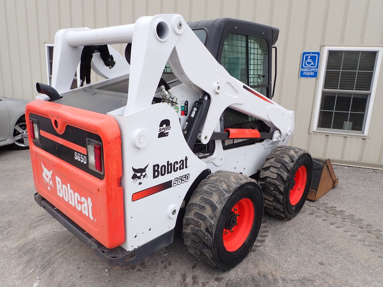 2015 BOBCAT S650 SKID STEER, EROPS, HEAT/AC, 2SPD, AUX HYDRAULICS, POWER BOBTACH