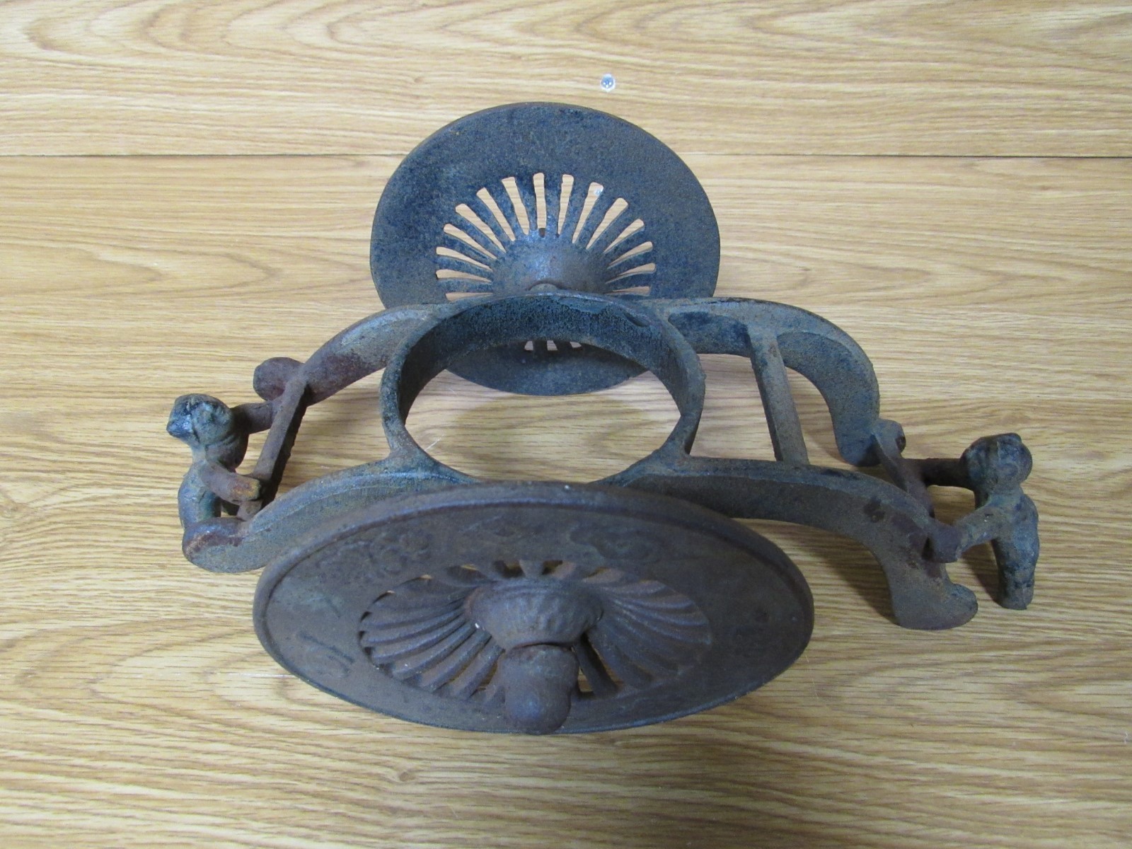 Antique Vintage Cast Iron Primitive-Two Men Pushing Wheels