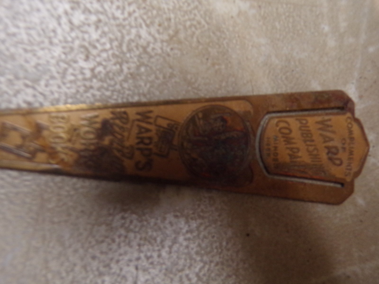 Old Brass Advertising Book Marker Warp Publishing Minden Nebraska