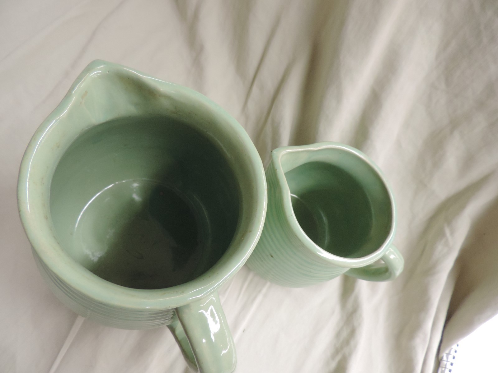 Two Vintage Western Stoneware Ribbed Pottery Pitchers Large and Small