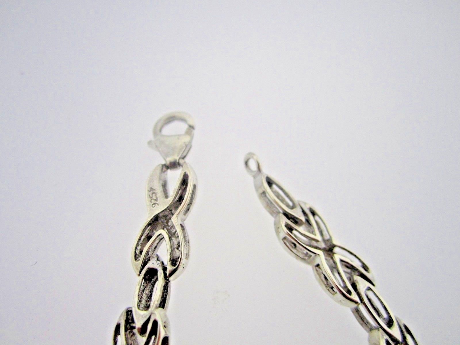 * .925 STERLING SILVER 1/2 CARAT X DESIGN BLACK & WHITE DIAMOND TENNIS BRACELET