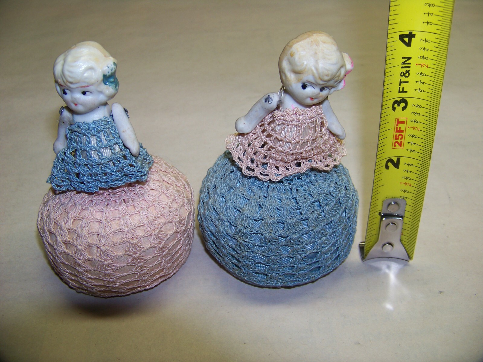 Pair of vintage doll pin cushions