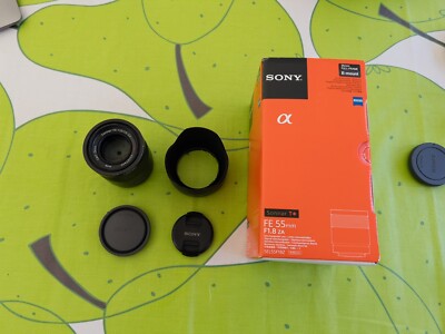Sony Zeiss Sonnar T* FE 55mm F1.8 ZA Lens with box, hood, and bag
