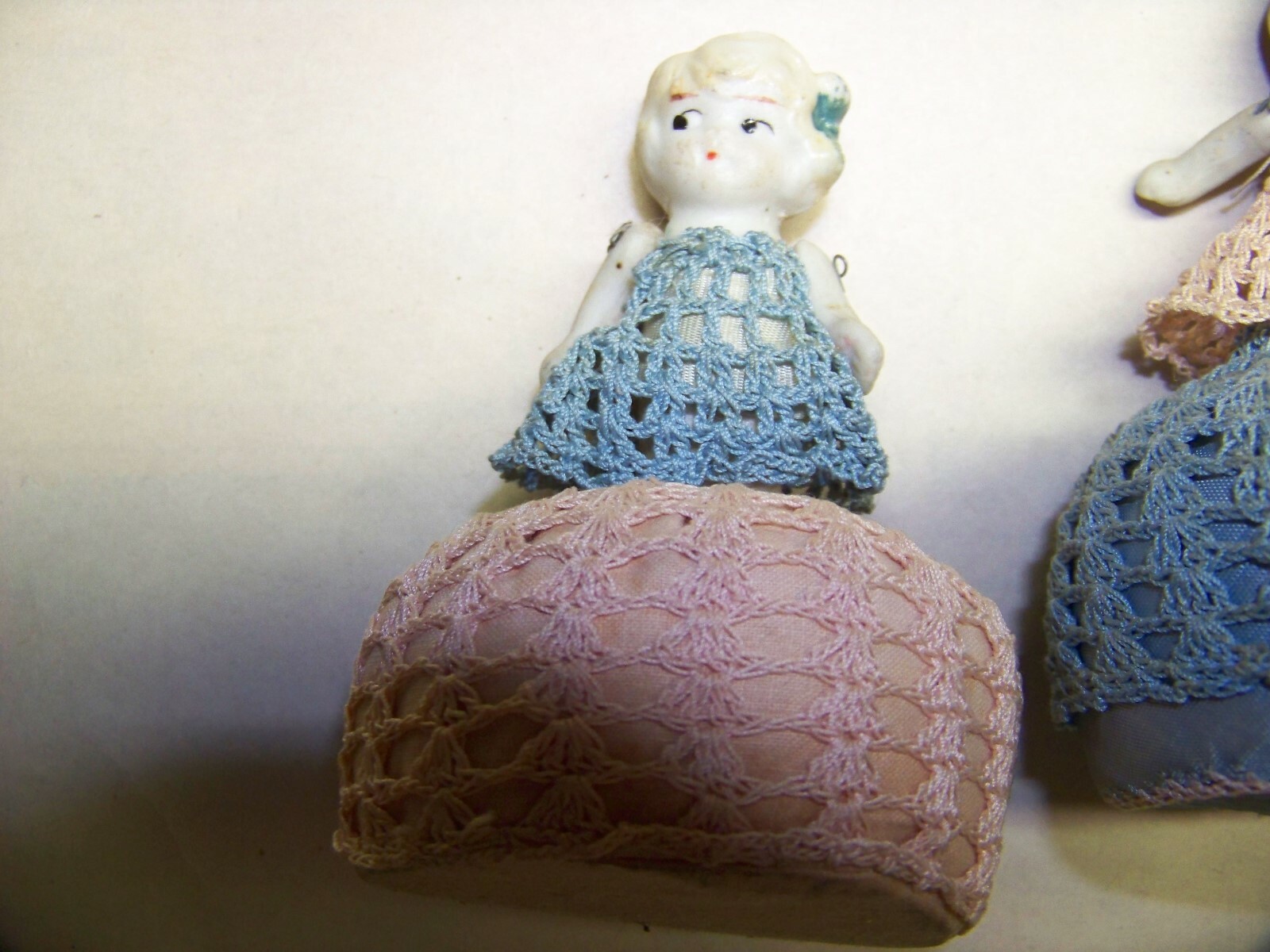 Pair of vintage doll pin cushions