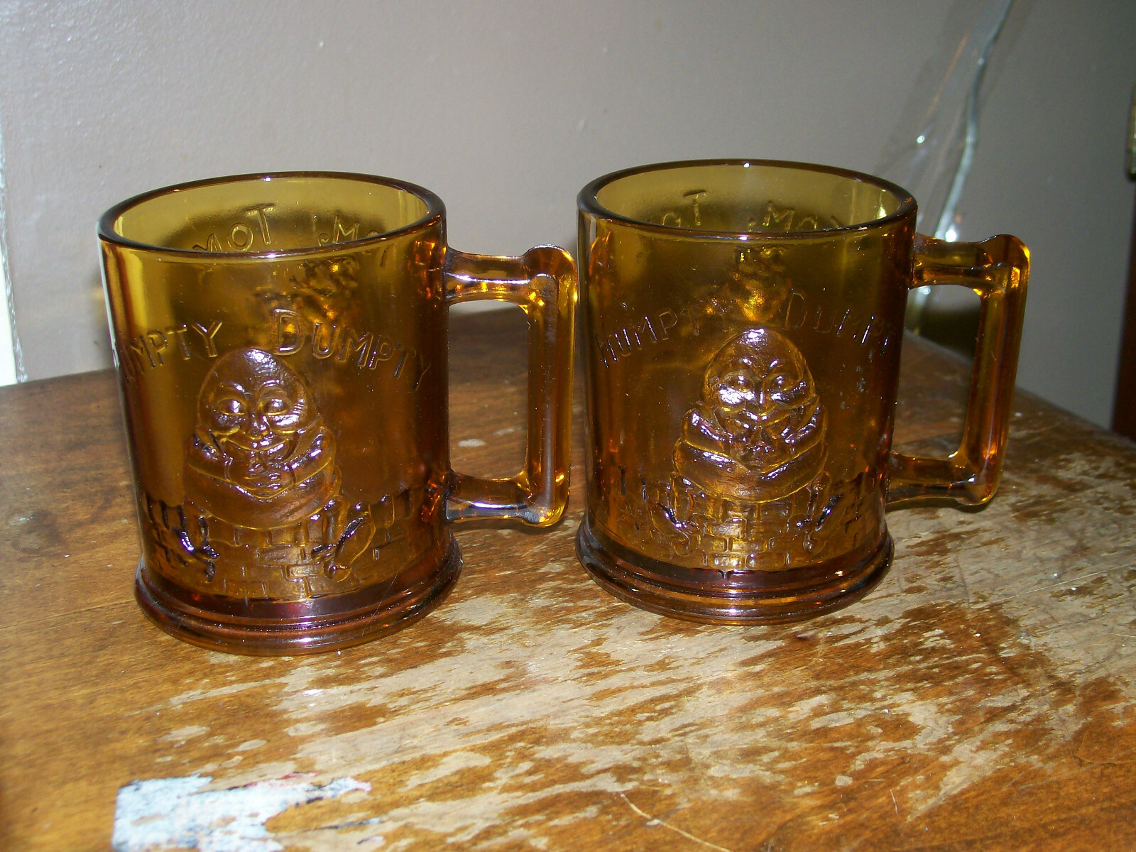 2 Amber Glass Mugs Childs Nursery Rhyme Humpty Dumpty Tom Tom Handle Vintage