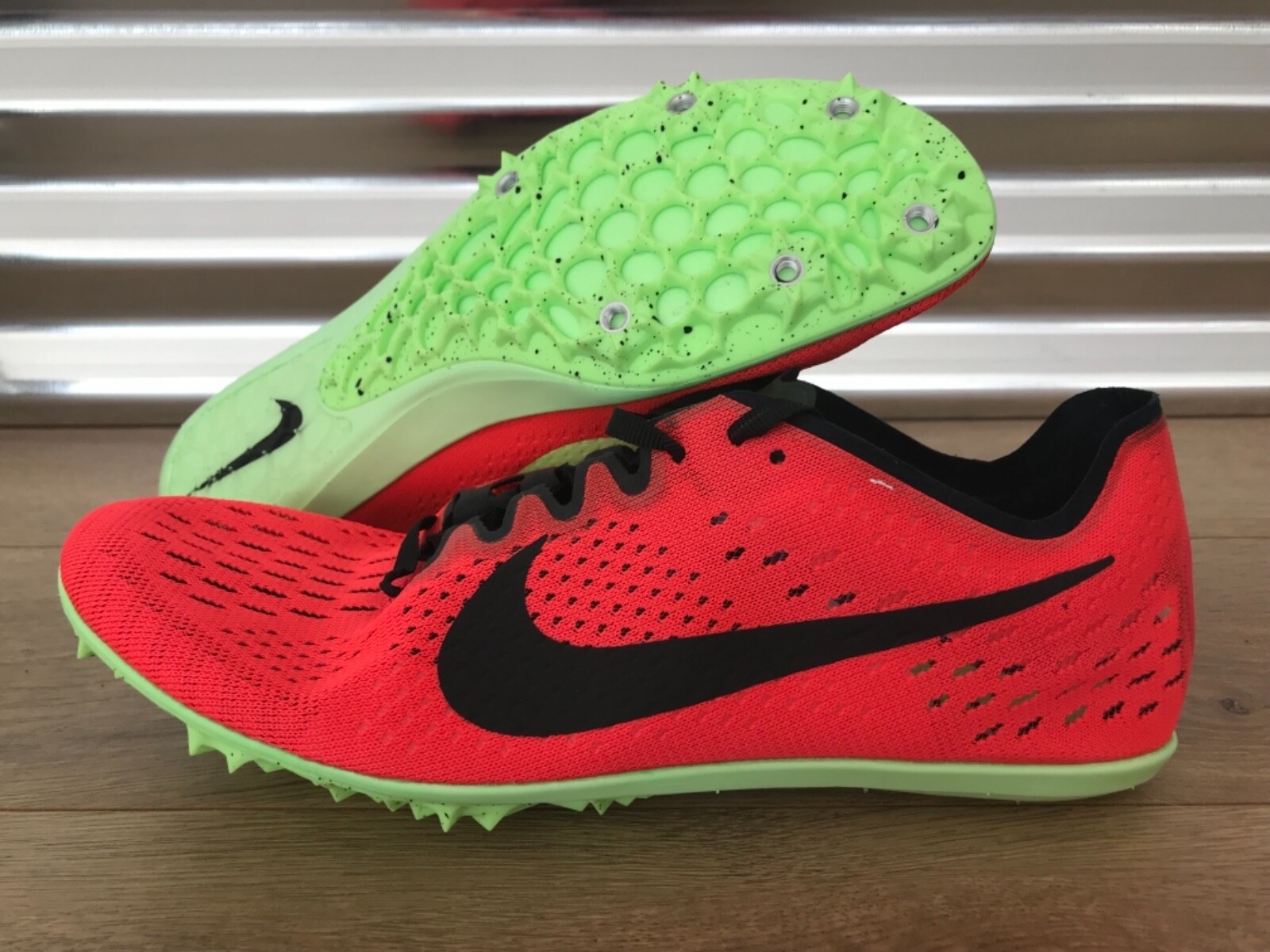 blue and yellow track spikes