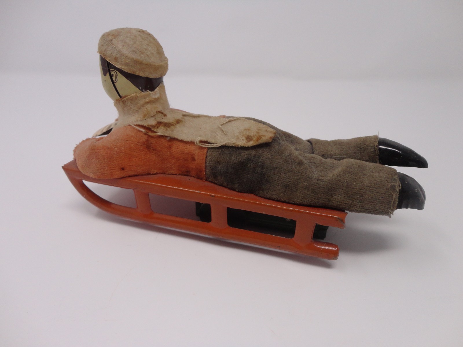 Vintage 1930's Japan Wind Up Mechanical Toy Boy on a Sled 6.75