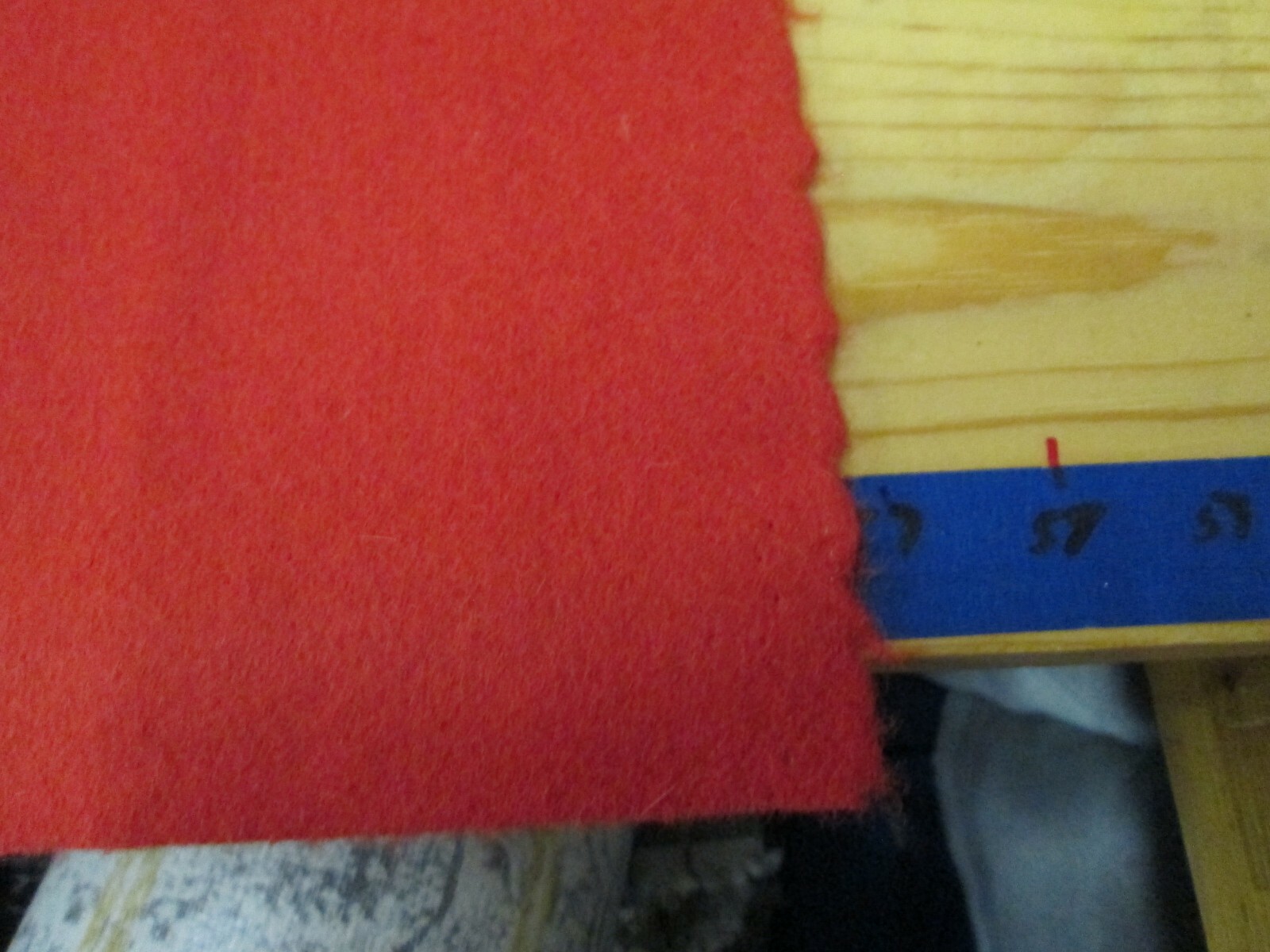 1 & 1/6 YARDS  X 57 INCHES WIDE OF A BRIGHT ORANGE WOOL FELT UPHOLSTERY FABRIC