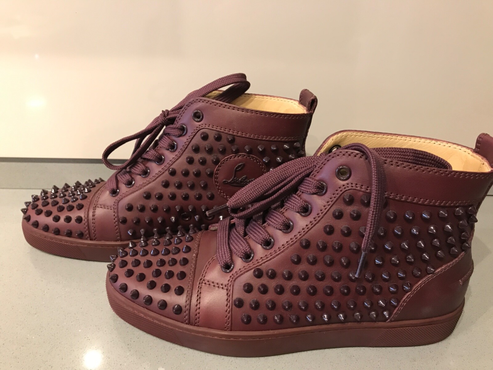 Burgundy louboutin sneakers best sale