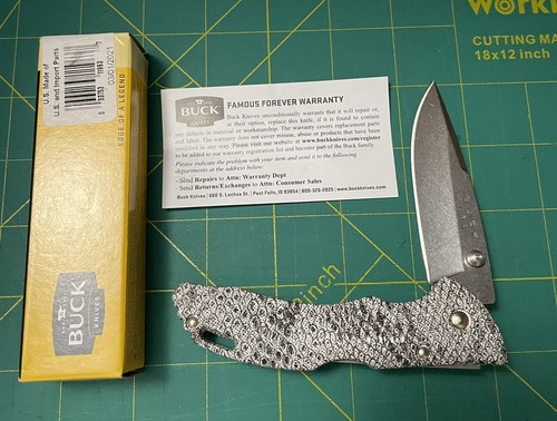 . Lockback Drop Point. Snakeskin Pattern Handle.