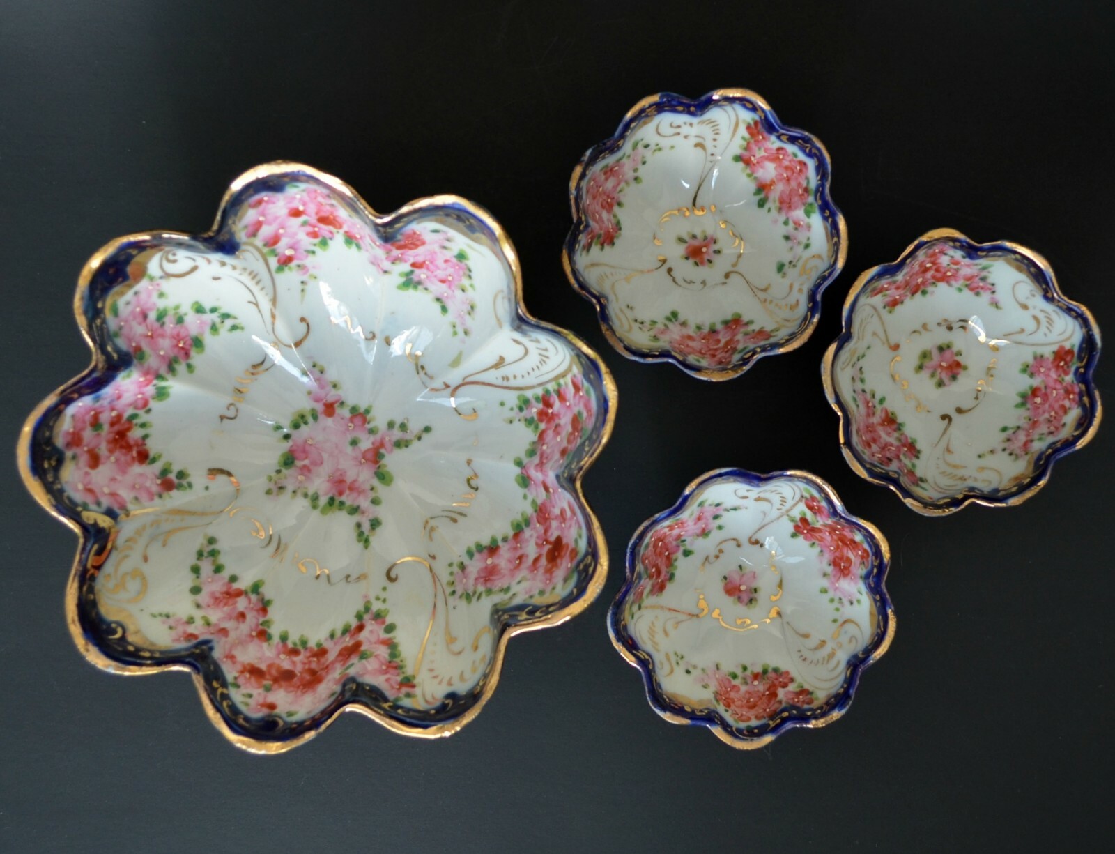 Set of 4 bowls Japan porcelain hand painted flow blue footed fruit nut dishes