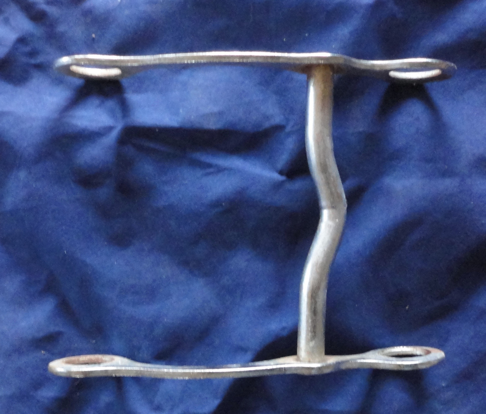An unmarked Vintage silver metal Horse bit
