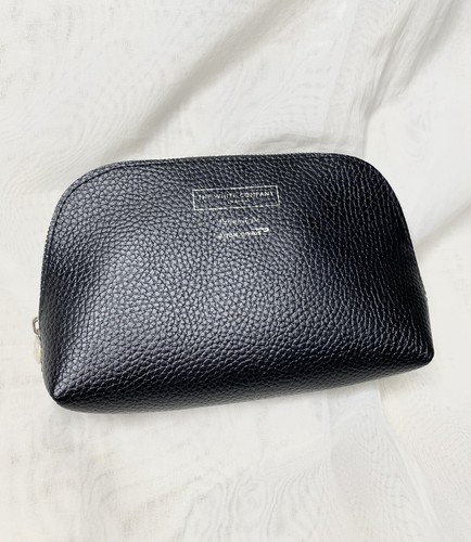 white company leather makeup bag