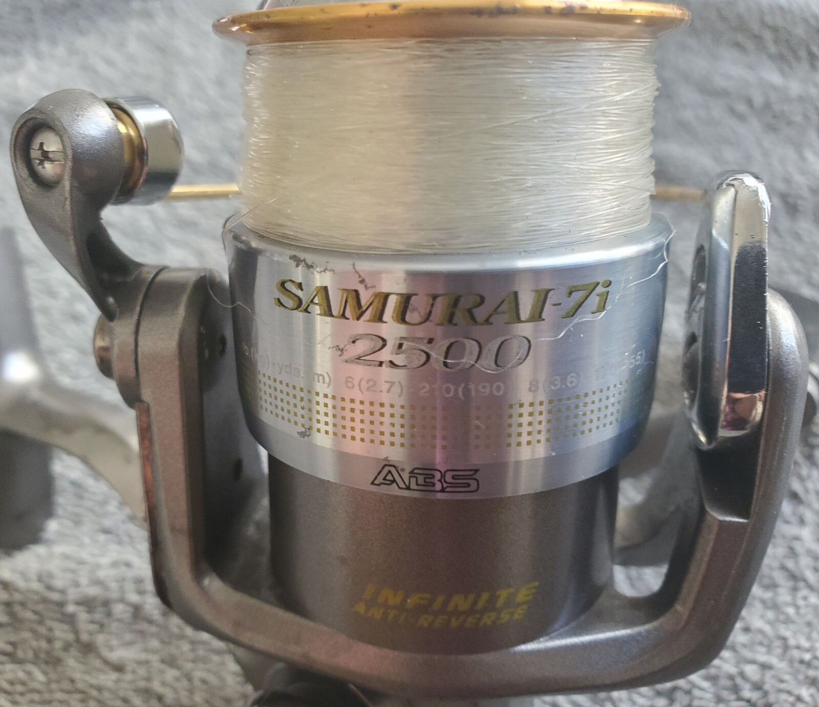 DAIWA SAMURAI-7I 2500 SPINNING REEL WITH BOX, PAPERS AND EXTRA