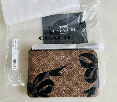 NWT COACH BOW CORNER ZIP WRISTLET TAN/BLACK SIGNATURE COATED