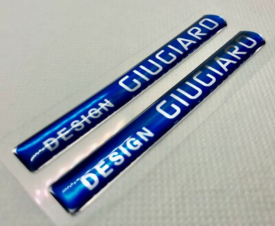 2 pcs. of Giugiaro Design Logo Badge 3D Domed Stickers. Silver blue. 83x10 mm