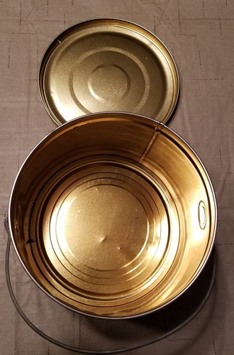 COLLECTIBLE RED METAL ROUND TIN WITH HANDLE