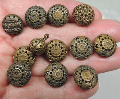 Antique dark coloured mother of pearl waistcoat buttons k with stamped detail have brass loop shank 12 dia