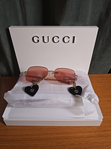 Gucci GG0724s gold with pink lenses. Hearts still have the