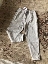 nike sweatpants with swoosh all over