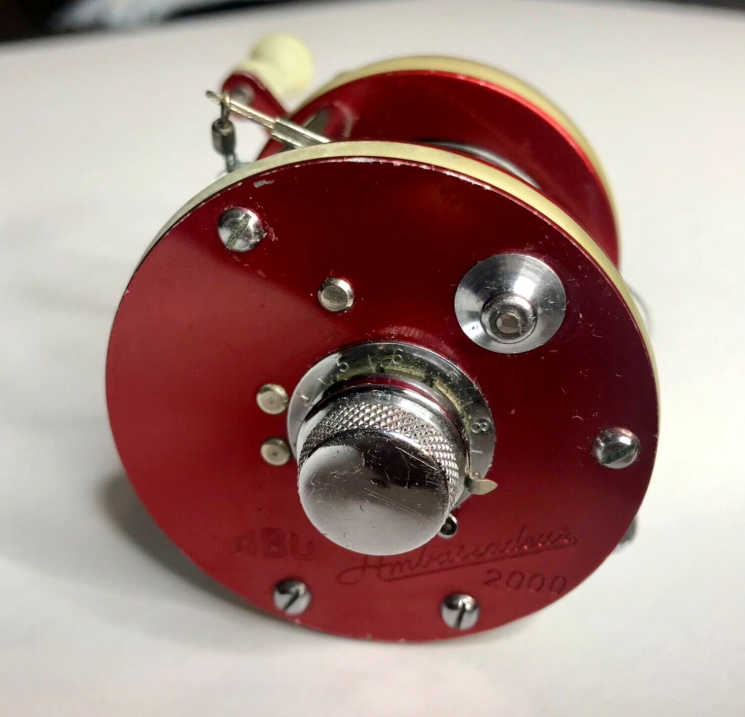 ABU Ambassadeur 2000 Vintage Casting Reel - Red & Ivory ABU Ambassadeur 2000 Vintage Casting Reel - Red & Ivory