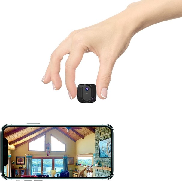 Hand pinching camera above smartphone displaying living room.