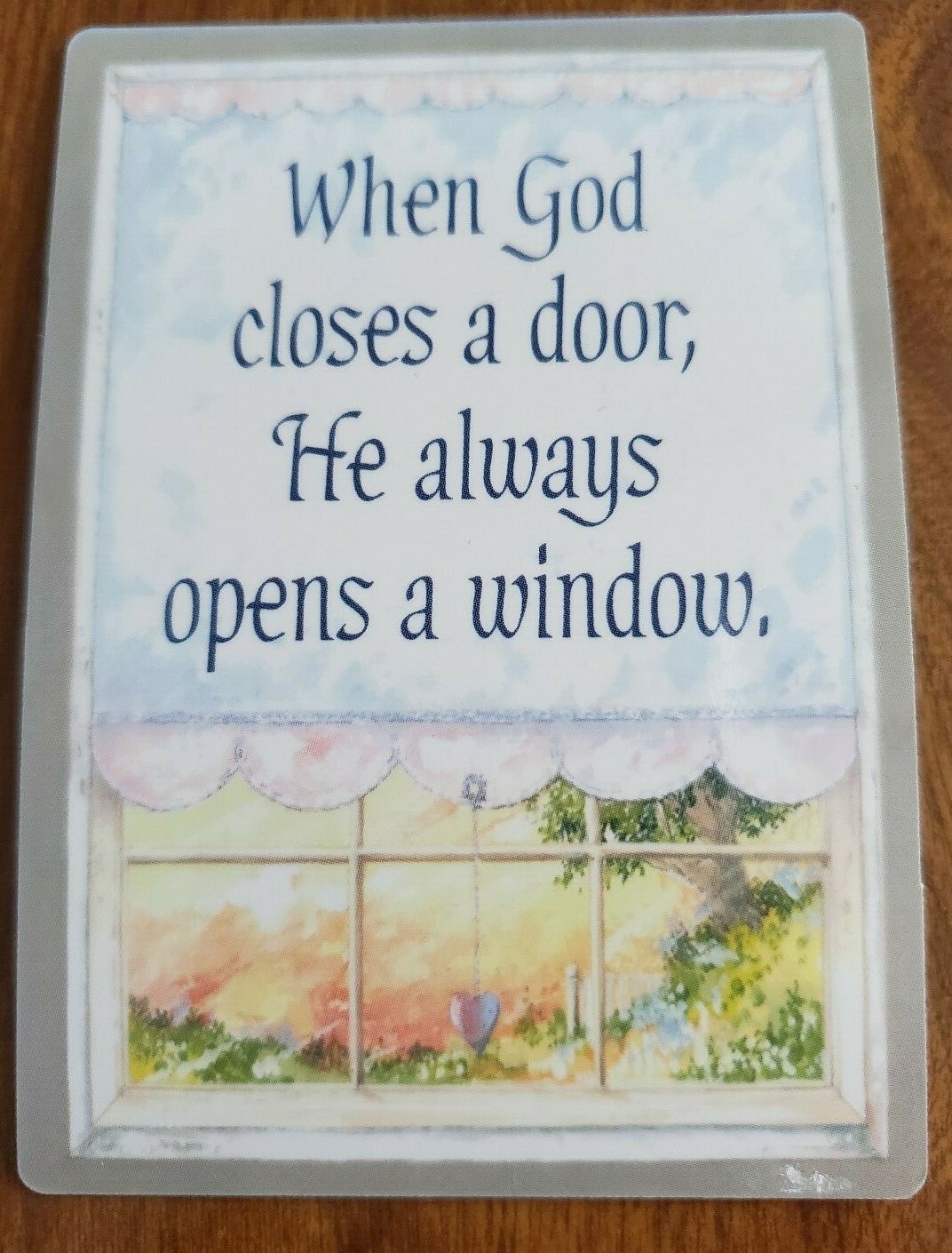 When God closes a door, He always opens a window' laminated wallet 
