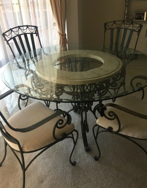 Designer Round Glass and Wrought Iron Dining Table includes 5 chairs