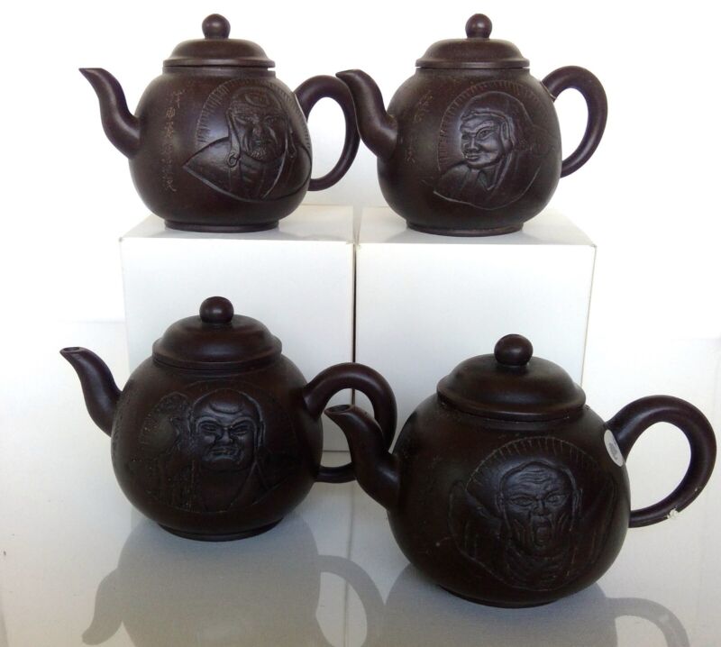 4 pcs Lohan Design Yixing Pottery Teapots. TE27-5