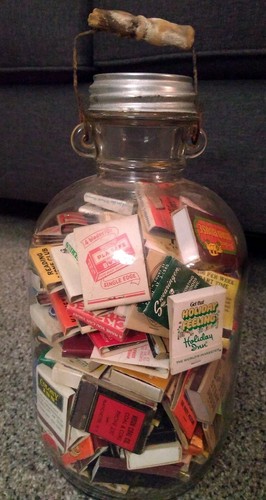 Antique Farmhouse clear glass jug filled with vintage matchbooks