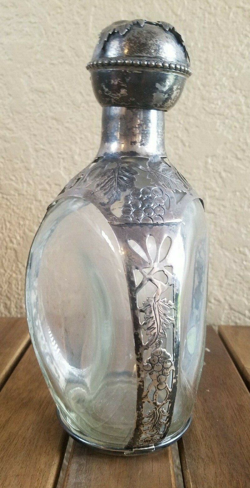 Sterling silver overlay on collectible Hague pinch side decanter