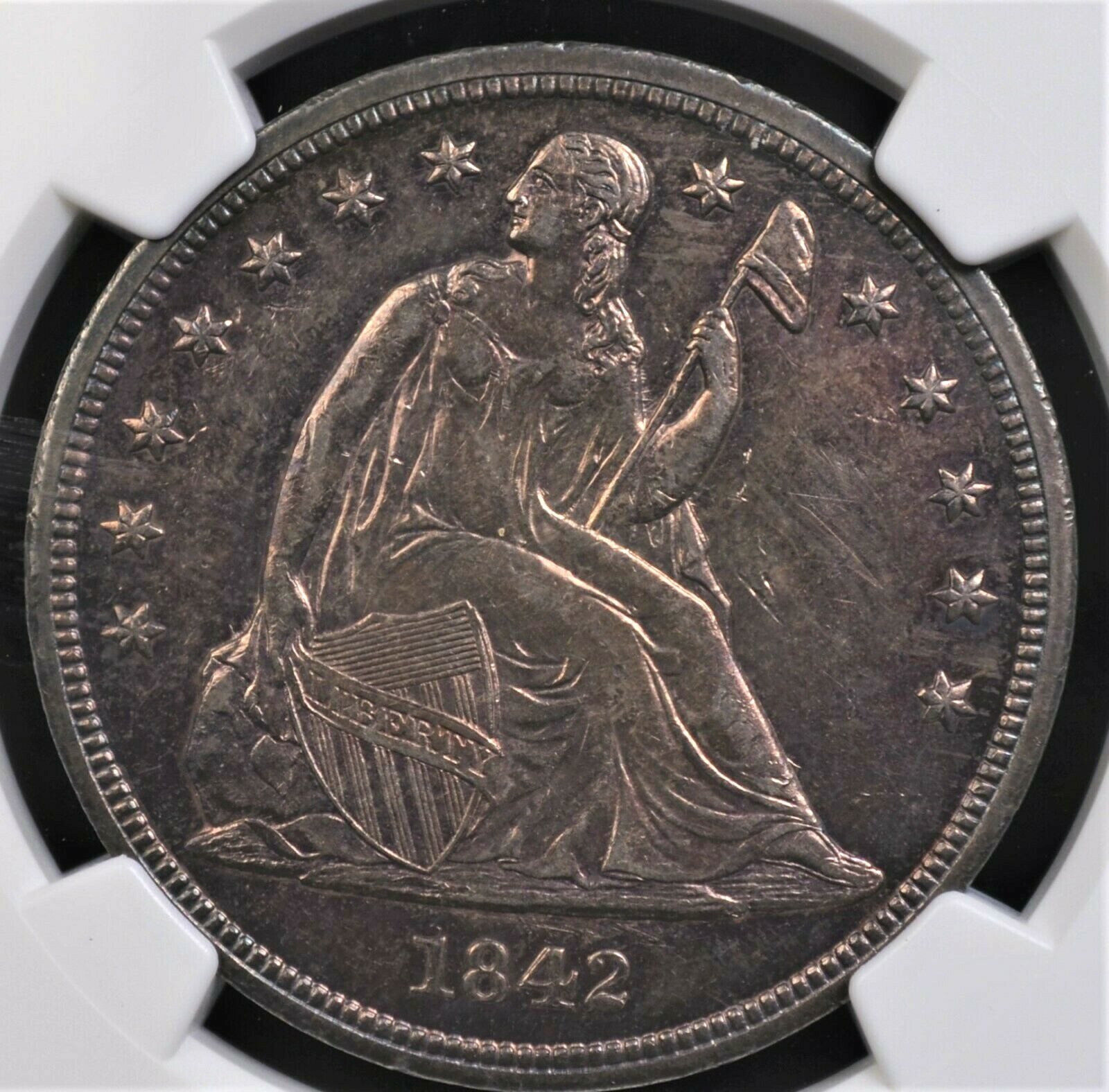 1842 SEATED LIBERTY DOLLAR NGC MS 61 GLASSY REFLECTIVE GRAPE AND