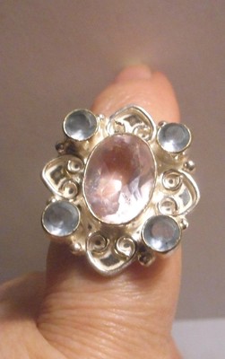Silver ring with Aquamarine round cur 4 small and Tourmaline stone 1 2 carats??