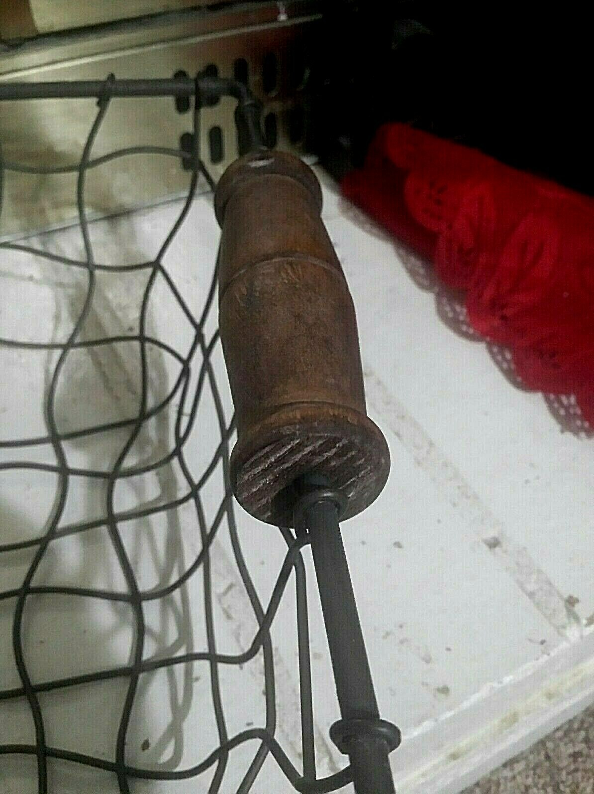 OLD FACTORY? METAL STURDY BASKET, WITH WOOD HANDLE.  VERY UNIQUE WIRE CURVES..