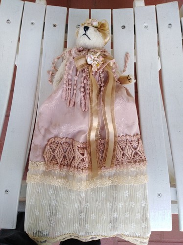 Vintage teddy bear in a fancy dress, victorian teddy bear
