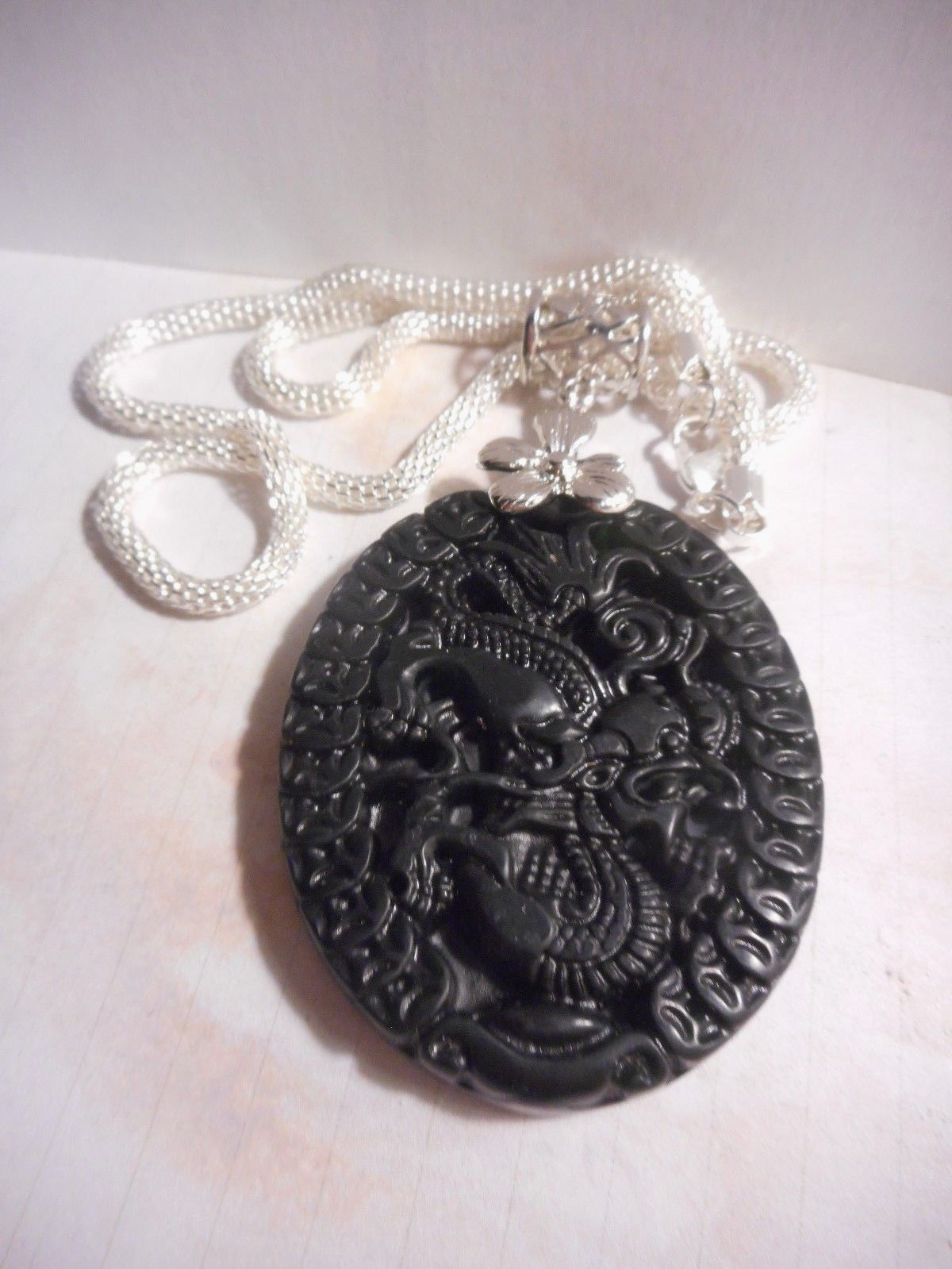 Black natural Artisan made real Jade dragon Chinese pendant on silver chain.