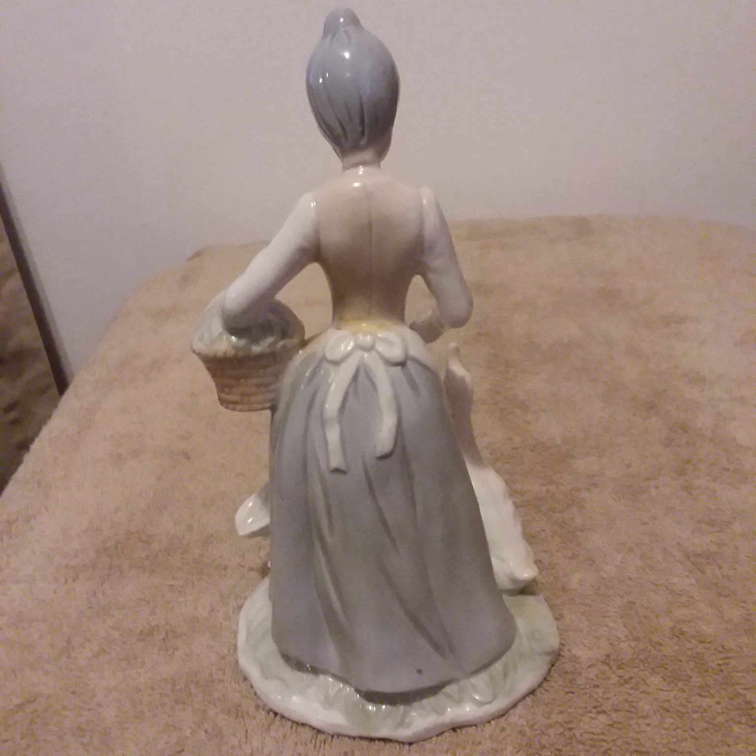 A Beautiful Vintage Lady feeding geese. great condition.